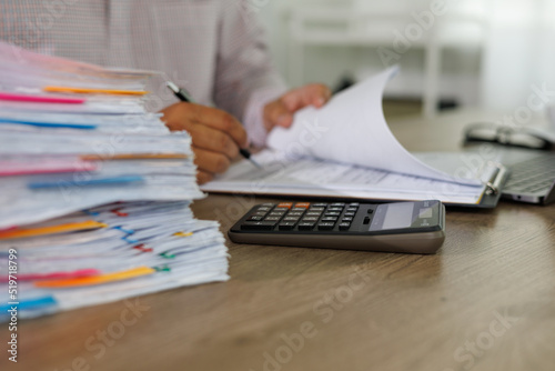 Businessman manager hands writing signing in paperwork or documentation documents on office desk