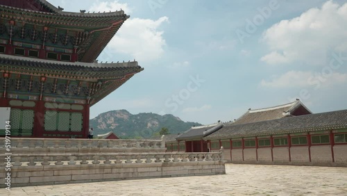 Closeup of Geunjeongjeon traditional building on summer sunny day, mountain hill in background in Seoul, South Korea photo