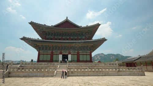 View of Geunjeongjeon (Main Throne Hall and Korean National Treasure 223) at Gyeongbokgung Palace with people sightseeing photo