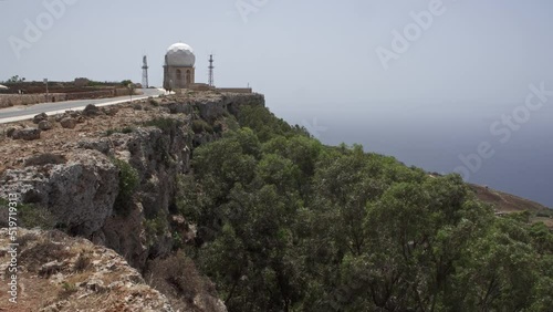 4K footage of a huge sea radar by the cliffs in the Island of Malta. photo