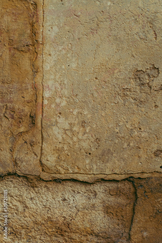 Obraz na płótnie Destroyed cracked wall background, brown light texture, paint streaks. w salonie