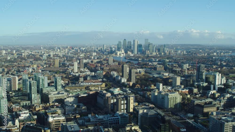 Aerial establishing shot of London skyline featuring Canary Wharf Aerial establishing shot of London skyline featuring Canary Wharf