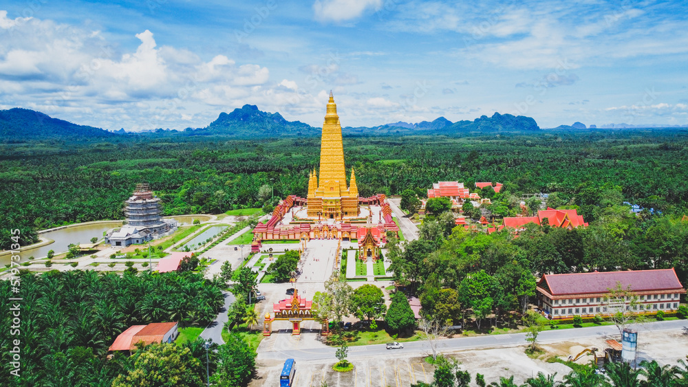 An aerial view of a large temple in Thailand that is beautiful and is a very popular tourist destination. Wat Bang Tong, Krabi Province, Thailand