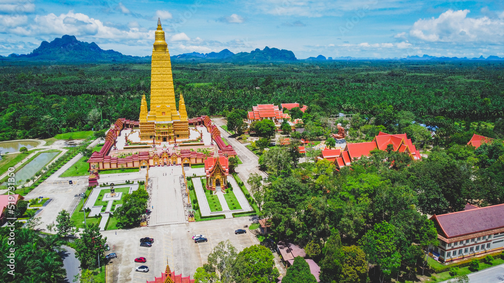 An aerial view of a large temple in Thailand that is beautiful and is a very popular tourist destination. Wat Bang Tong, Krabi Province, Thailand