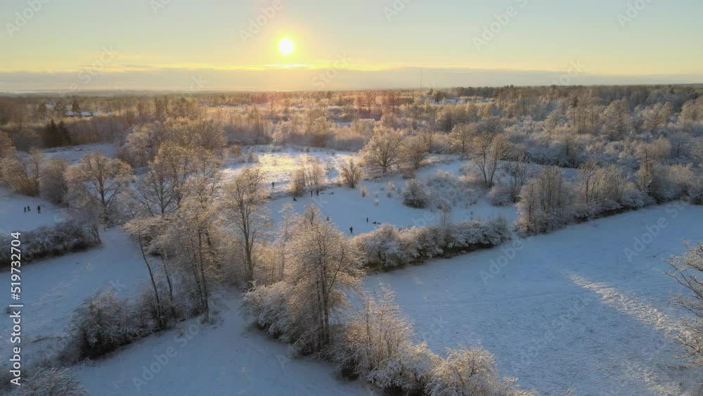 Aerial view out over beautiful big fields with lots of trees in a snowy landscape on a sunny day in Karlskrona, south of Sweden. Aerial view out over beautiful big fields with lots of trees in a snowy landscape on a sunny day in Karlskrona, south of Sweden.