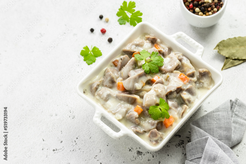 Slow cooker creamy chicken gizzards, giblets, offal. Top view, copy