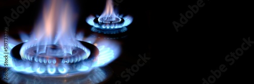 gas flame burns on a stove