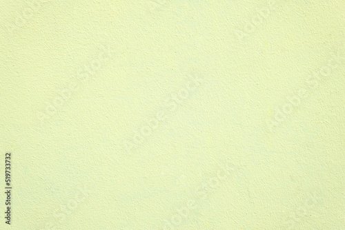 Horizontal shot of wall with texture in soft yellow colour