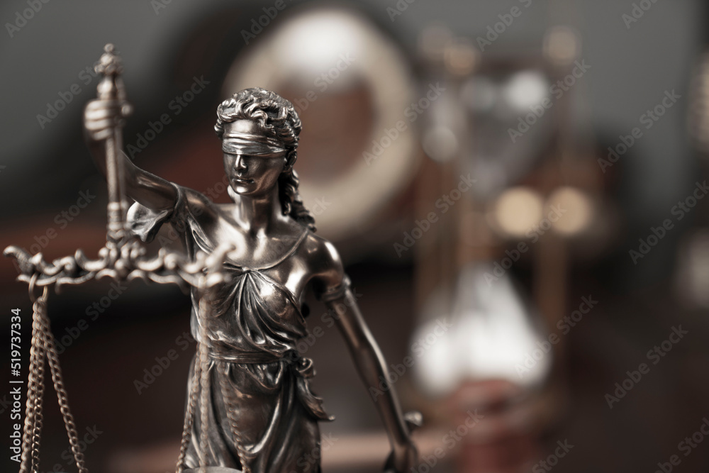 Law and justice concept. Justice symbol - Themis sculpture on gray background.