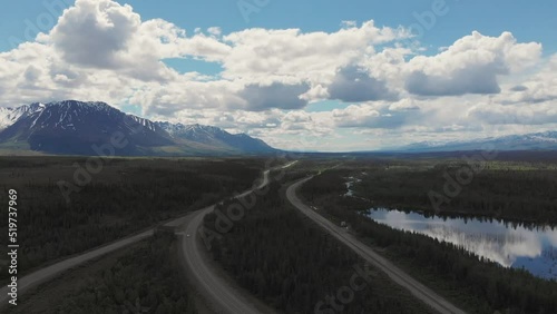 4K Drone Video of Mountain Peaks and Granite Creek near Denali National Park in Alaska on Sunny Summer Day photo