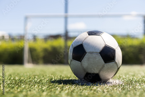 close-up view of leather soccer ball on green grass. © Angelov
