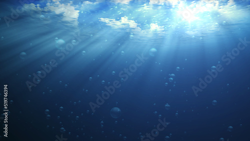 Underwater lighting creates beautiful curtains and bubbles. It consists of sunlight from the cloudy sky above through the deep blue water, creating a beautiful curtain of light reflecting the water.