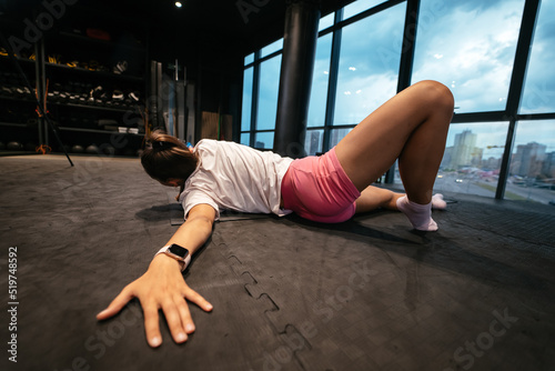 Young woman doing exercises in the gym
