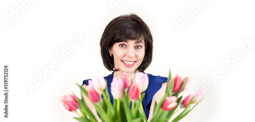 A young mother received flowers as a gift for her birthday Isolated white background.
