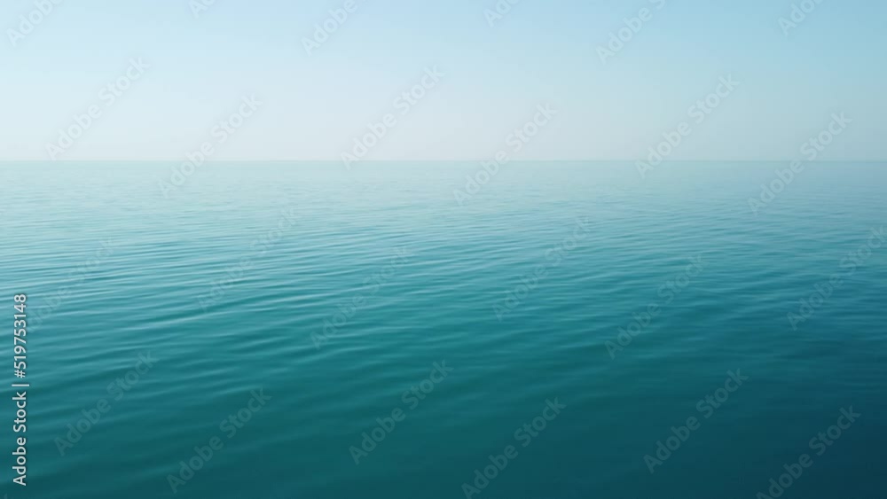 Abstract aerial sea summer ocean sunset nature background. Small waves on azure water surface in motion blur with golden bokeh lights from sun. Holiday, vacation and recreational concept. Slow motion Abstract aerial sea summer ocean sunset nature background. Small waves on azure water surface in motion blur with golden bokeh lights from sun. Holiday, vacation and recreational concept. Slow motion