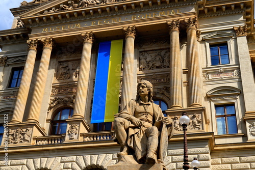 Old ancient building of National Museum Prague with Ukrainian flag on facade in support of Ukraine, Czech Republic