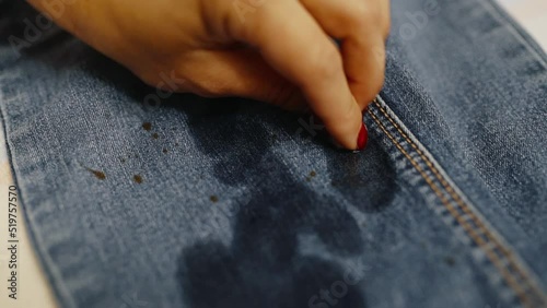 Removing stains from the surface of denim pants with a special tool