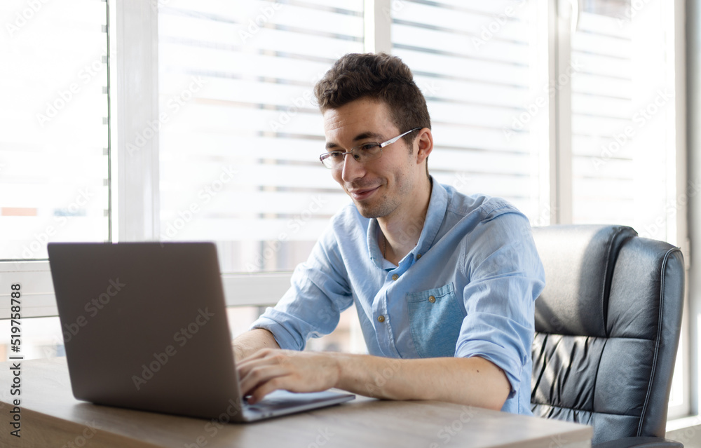 Relaxed young man working at home. Relaxed young man working at home.