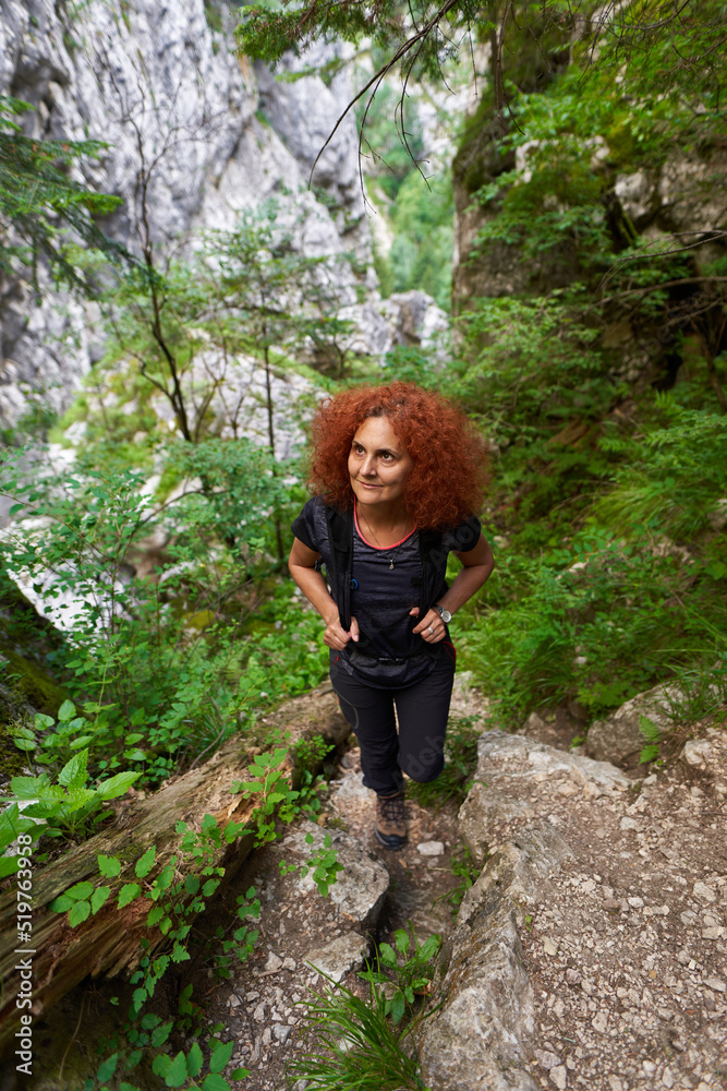 Woman backpacker in a canyon