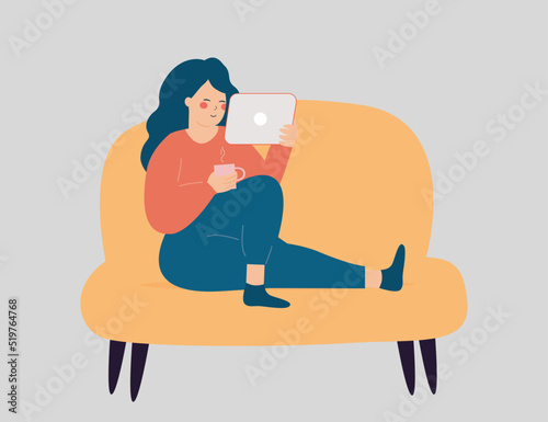 Self employed woman is working at the tablet while drinking her coffee. Freelancer teenage girl sitting on the couch and using her tablet to run her business online. Vector illustration