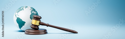 Judge's Gavel and Earth Planet on Blue Background