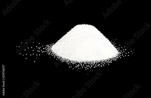 A pile of sugar or salt with a scattering of crystals around.