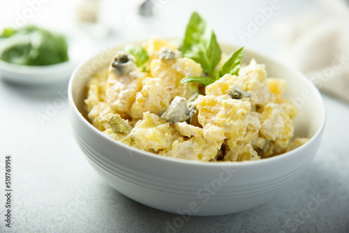 Traditional homemade potato salad with gherkins