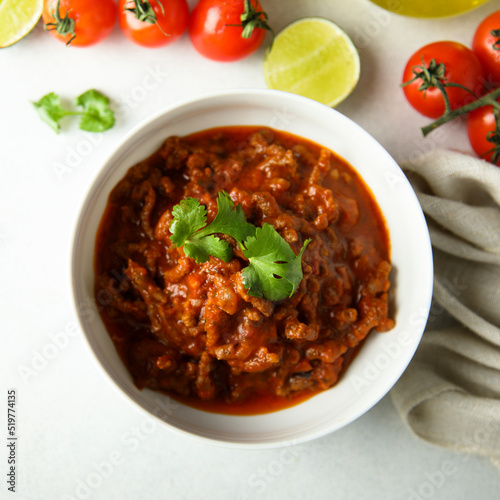 Homemade beef ragout with cilantro and lime