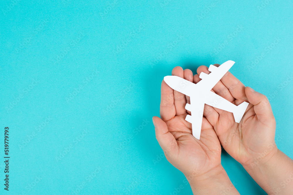 Holding an airplane in the hands, taking a flight, planning a vacation
Holding an airplane in the hands, taking a flight, planning a vacation
