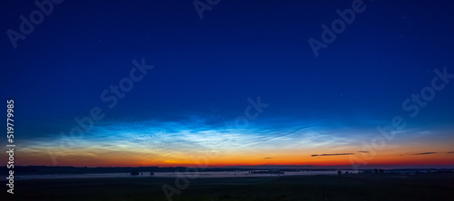 Night shining - Noctilucent clouds at night, panorama © lukjonis