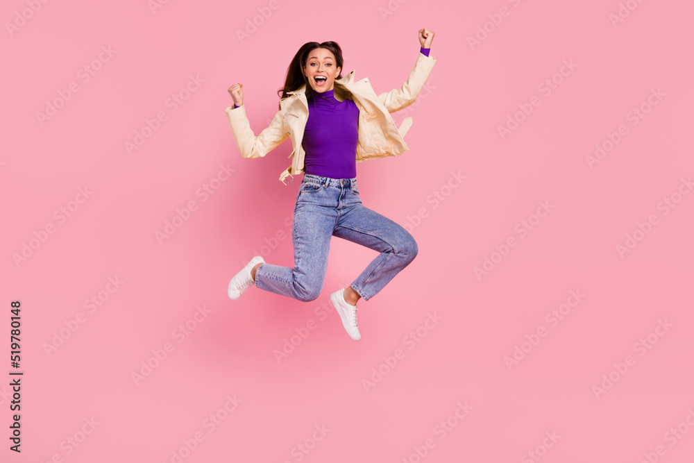 Full body photo of hooray brunnette lady jump yell wear jacket jeans boots isolated on pink color background Full body photo of hooray brunnette lady jump yell wear jacket jeans boots isolated on pink color background