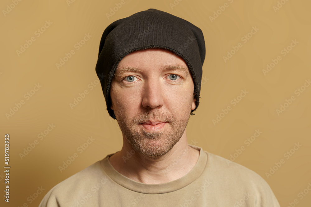 Portrait of a man with blue eyes. European in a hat, close-up Portrait of a man with blue eyes. European in a hat, close-up