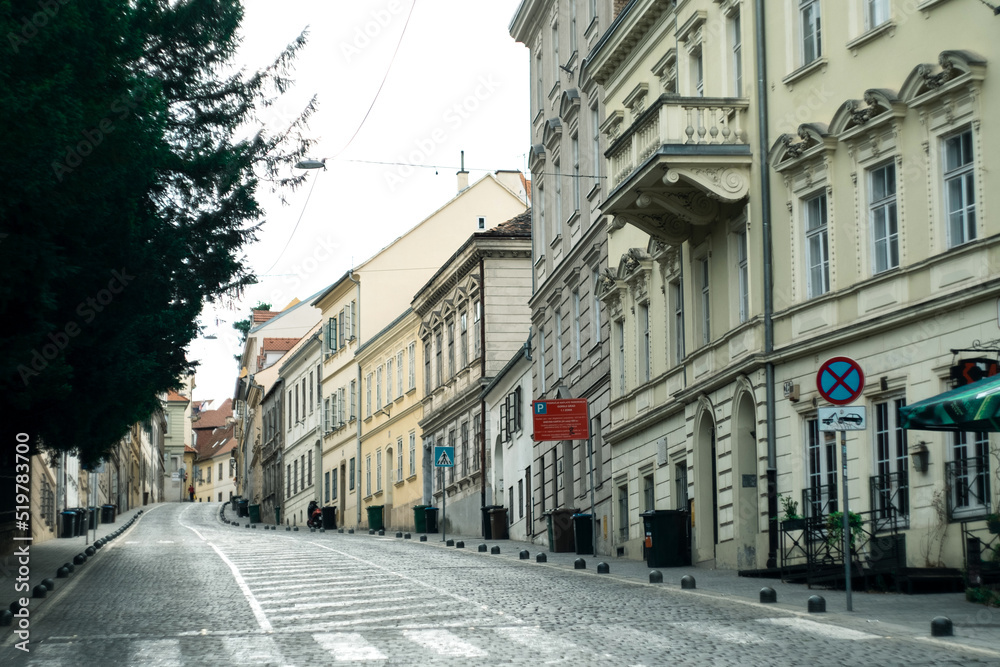 Empty asphalt road and old historic street in downtown of Zagreb, Croatia. Translation from Croatian - parking Tuskanac bypass