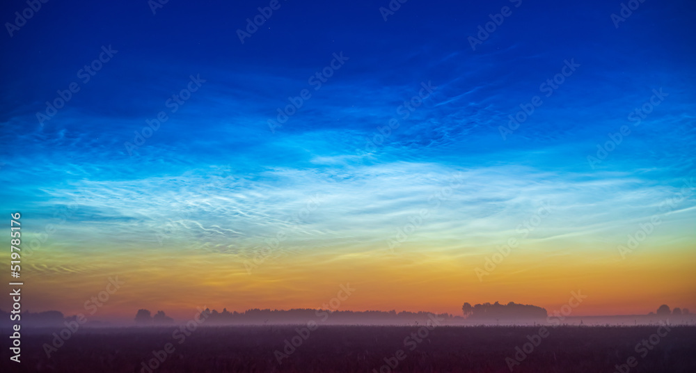 Fototapeta premium Night shining - Noctilucent clouds at night, panorama