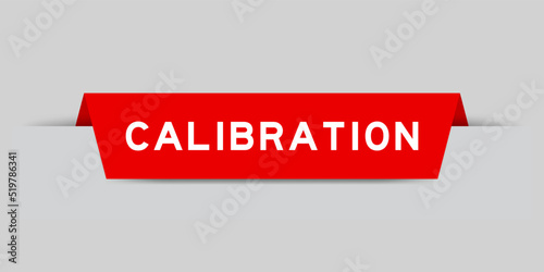 Red color inserted label with word calibration on gray background