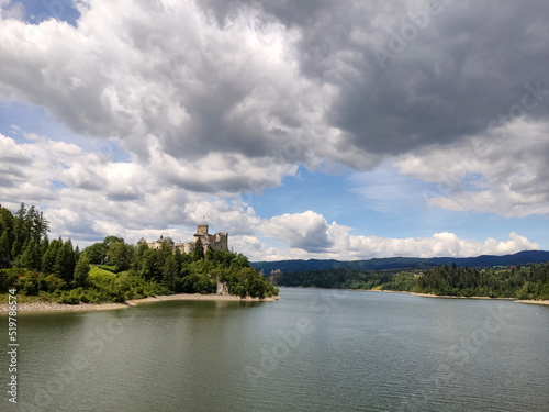 Niedzica Castle Also Known as Dunajec Castle by Lake Czorsztynin the Pieniny Mountains, Poland. And Tourist Ferrys in the Lake. Summer Day With Fast Moving Clouds. Czorsztyn Castle at the Background