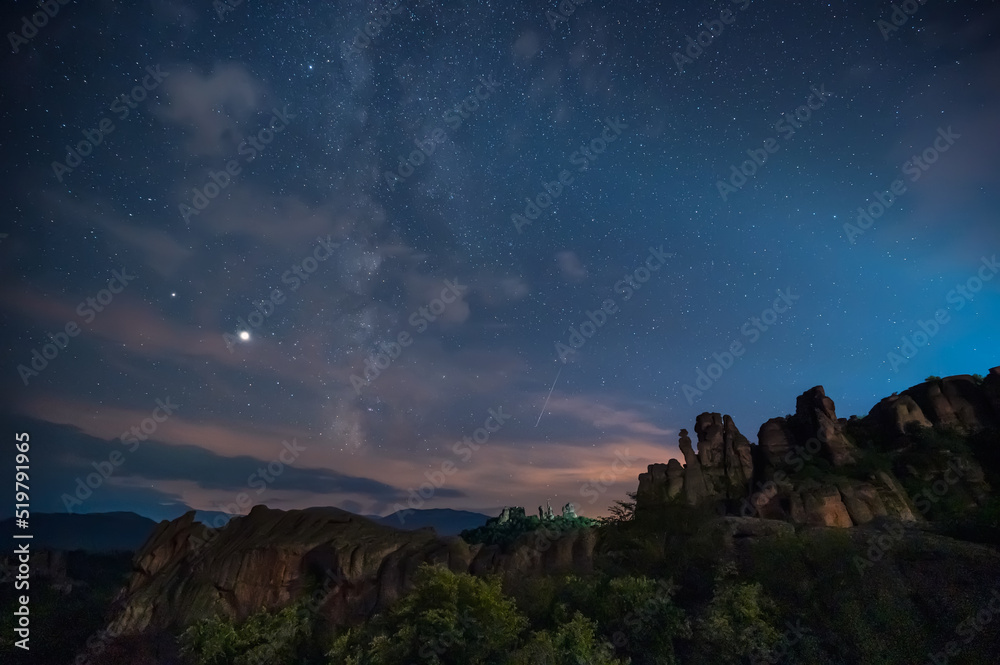 Milky Way and the Perseids. Long time exposure night landscape with Milky Way Galaxy during the Perseids flow above the Belogradchik Rocks in Balkan Mountains, Bulgaria.