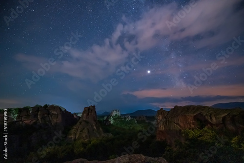 Long time exposure night landscape with Milky Way Galaxy above the Belogradchik Rocks in Balkan Mountains, Bulgaria.