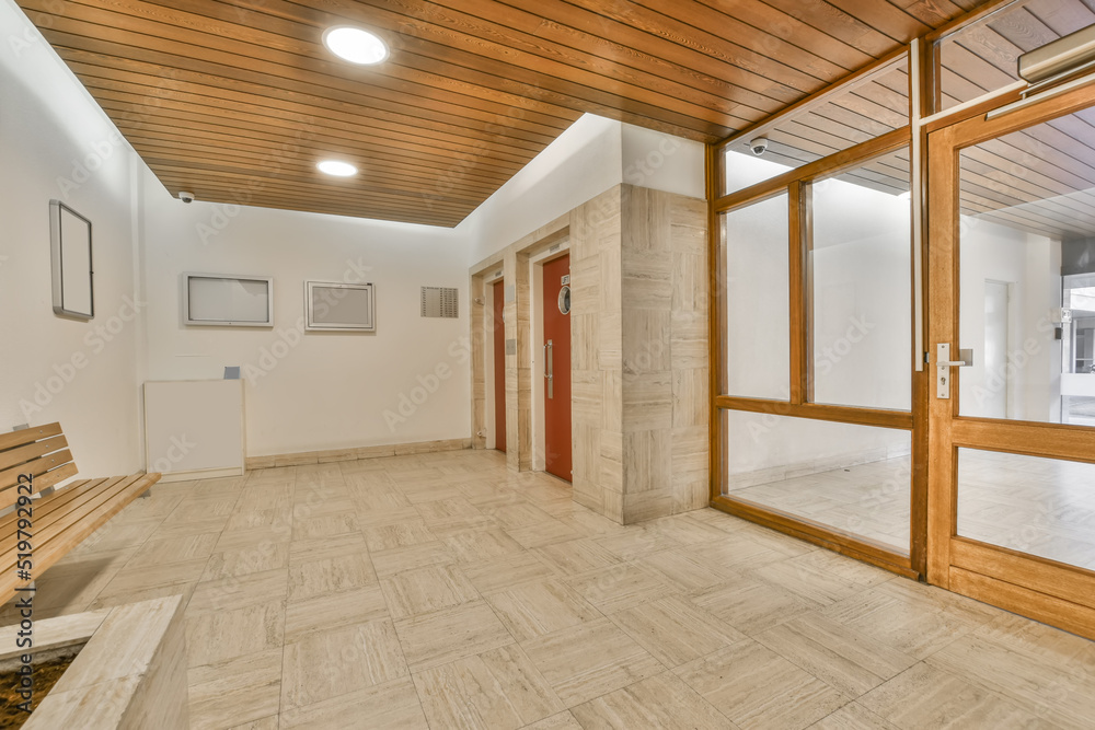 Lobby of a building with entrance to some elevators Lobby of a building with entrance to some elevators