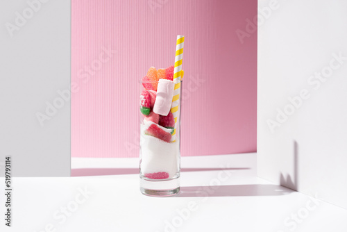 Glass with colorful jelly candies photo