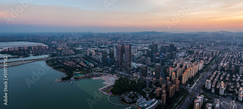 Aerial view of city skyline and modern commercial buildings in Suzhou at sunset  China.