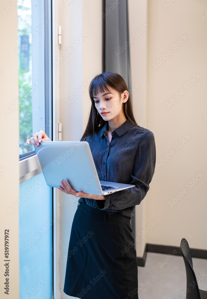 Working business women in conference rooms with black shirts and skirts Working business women in conference rooms with black shirts and skirts