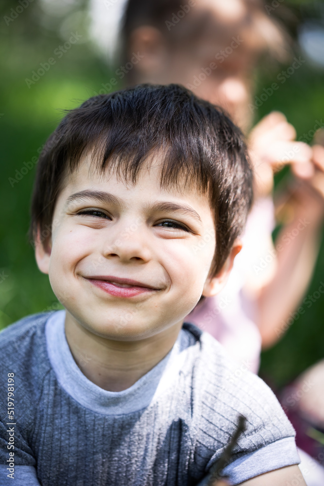 Portrait of little adorable smiling boy on summer sunny day Portrait of little adorable smiling boy on summer sunny day