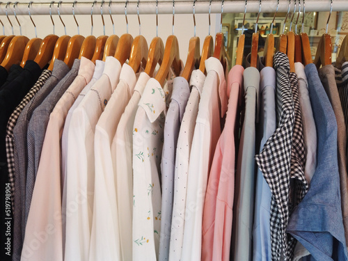 close up of stack of clothes hanging 