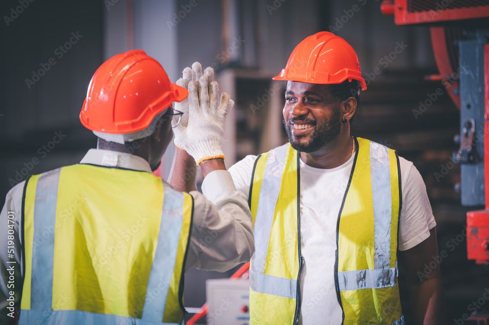 Teamwork African American worker in the factory, Black man afro work heavy industrial Teamwork African American worker in the factory, Black man afro work heavy industrial