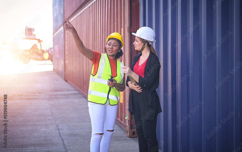 Team worker American women Work in an international shipping yard area Export and import delivery service with containers