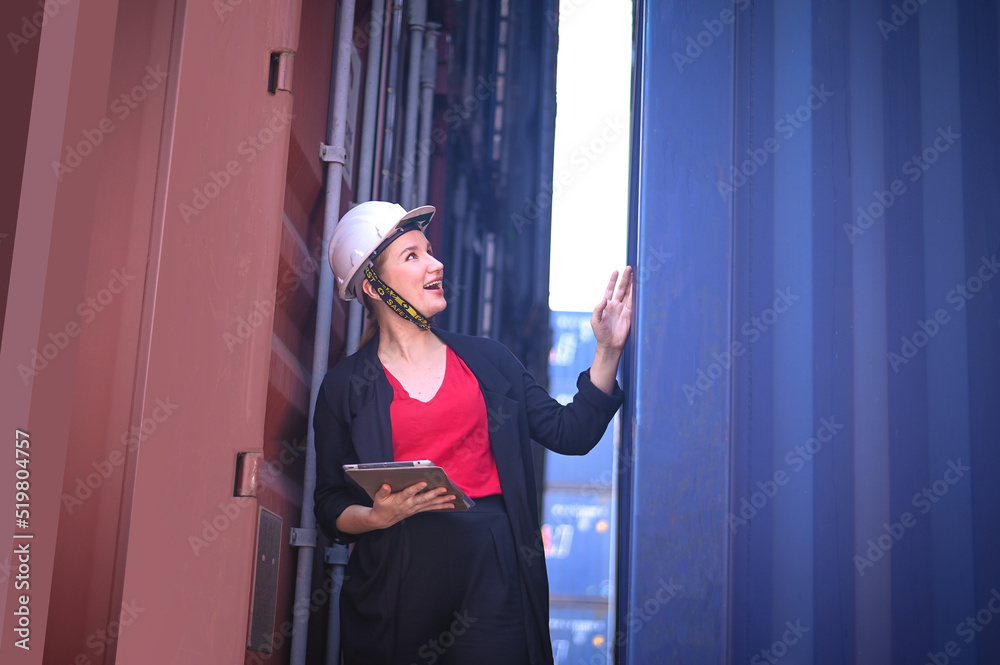 Female Engineer worker woman working checking at Container cargo harbor to loading containers.