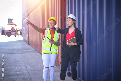 Photo Team worker American women Work in an international shipping yard area Export an
