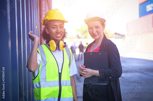 Team worker American women Work in an international shipping yard area Export and import delivery service with containers