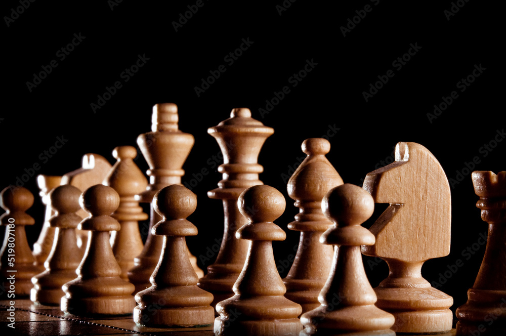 close up of chess pieces on the chessboard close up of chess pieces on the chessboard